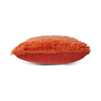 red fluffy textured pillow