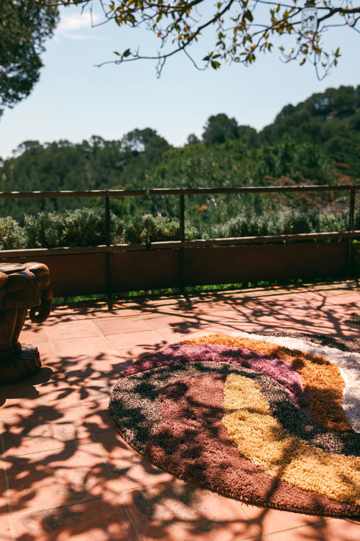 brown cream terra and maroon round tufted rug