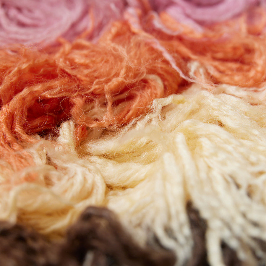 brown yellow orange and pink fluffy rug