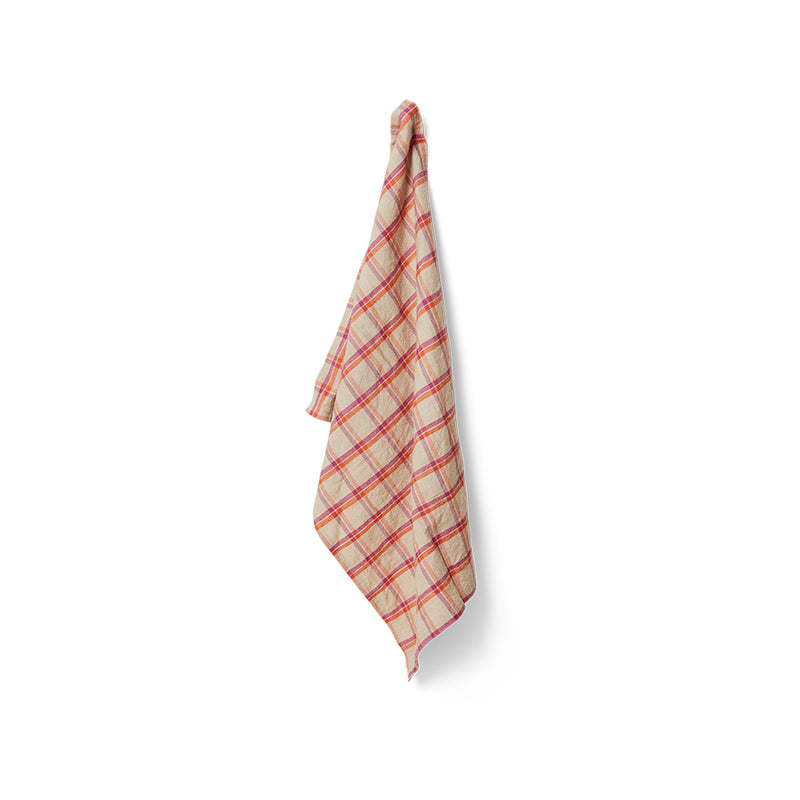 Plaid towel hanging on a white background