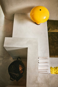 modern living room with concrete display and yellow table lamp