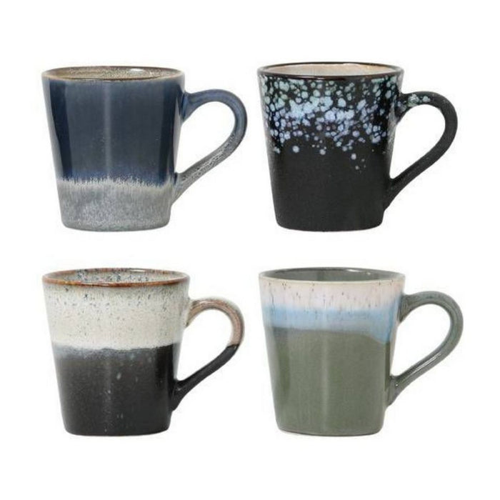 Set of four ceramic mugs with gradient designs on a white background