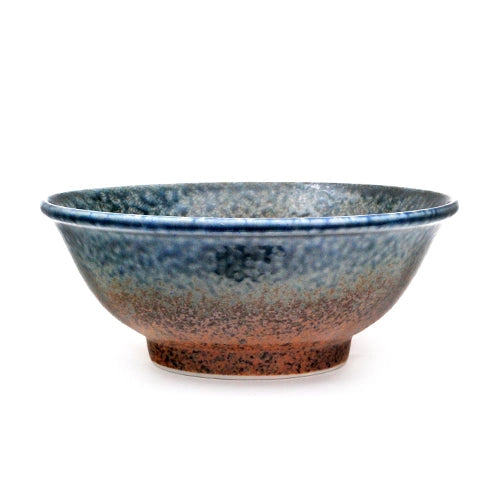 Ceramic bowl with blue and brown gradient on a white background