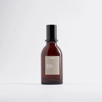Brown bottle with black cap on a white background