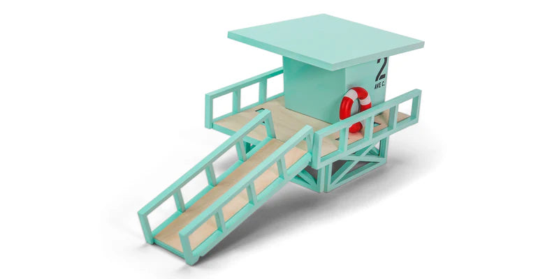 Toy lifeguard stand with a red life preserver on a white background
