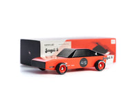 Model car with a red body and black top on a white background