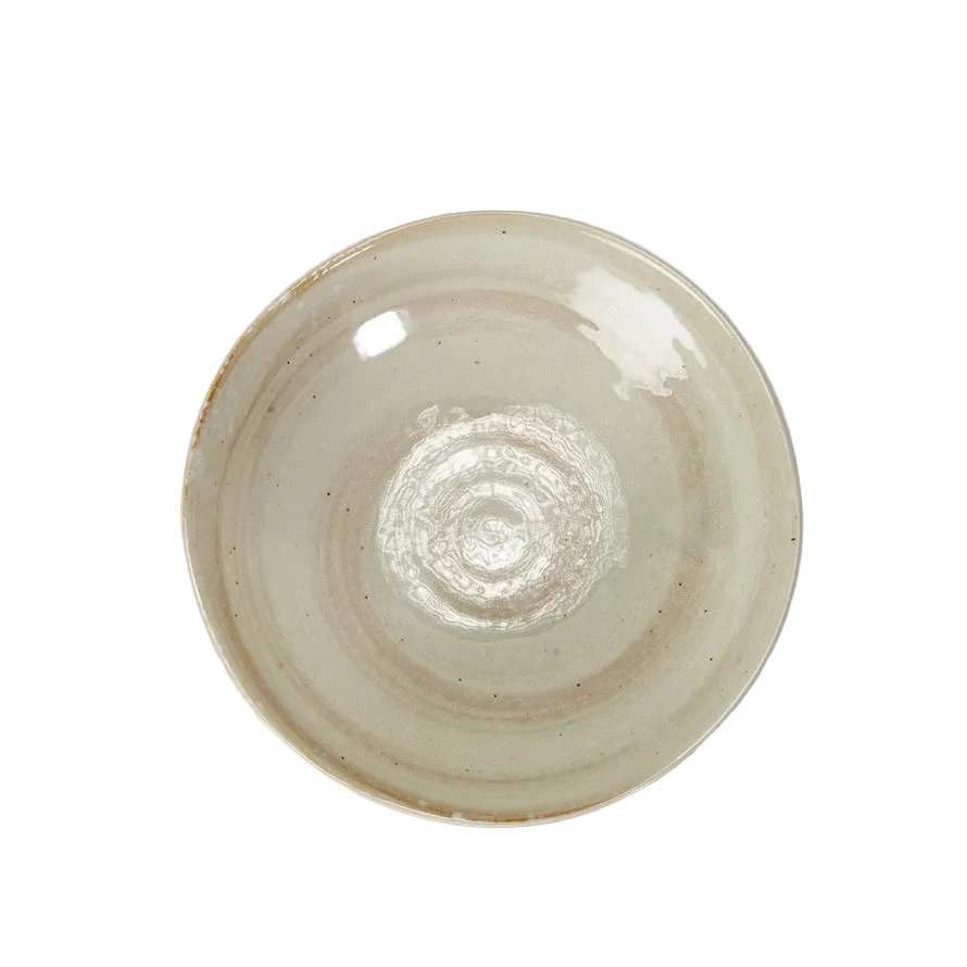 Ceramic plate with a textured surface on a white background