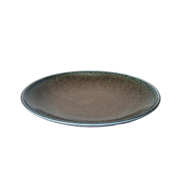 Ceramic plate with speckled design on a white surface