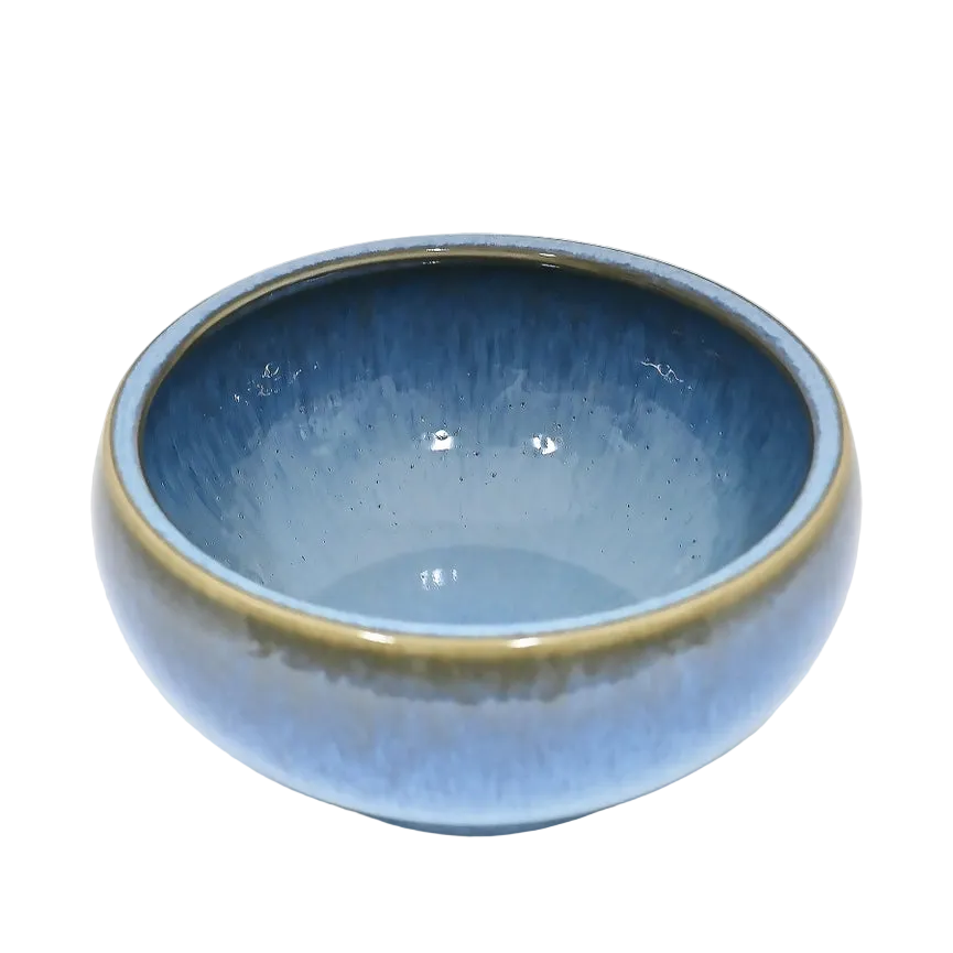 Blue ceramic bowl on a white background