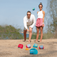 colorful set of soft boccia balls on beach