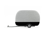 Small wooden silver and black toy airstream camper on a white background