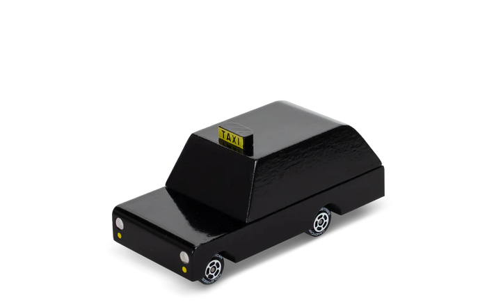 Black toy taxi with yellow 'TAXI' sign on a white background
