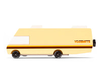 Toy van with a yellow body and black wheels on a white background