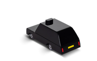 Black toy car with red and yellow details on a white background