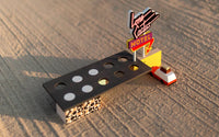 Model of a motel sign and truck on a textured surface