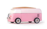 Pink and white toy van on a white background