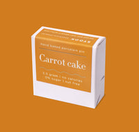 Box of 'Carrot cake' hand baked porcelain pin on a brown background