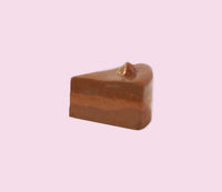 Chocolate slice on a pink background