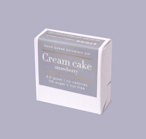Box of cream cake strawberry flavor on a gray background