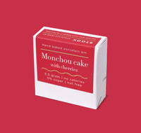Box of 'Monchou cake with cherries' on a red background