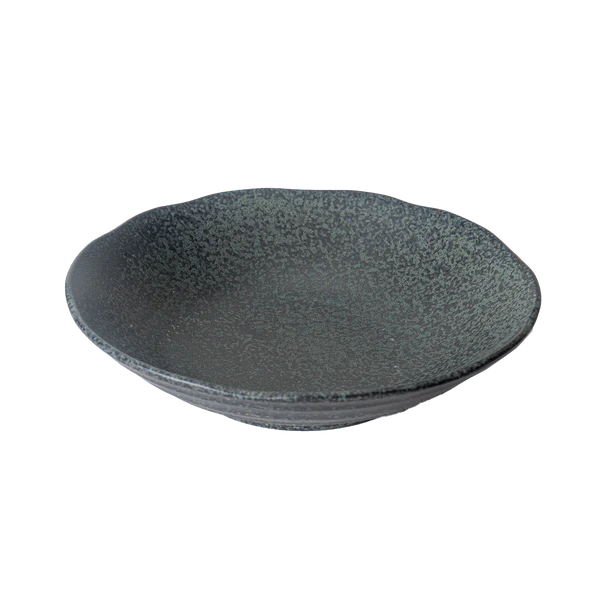 Black speckled ceramic bowl on a white background