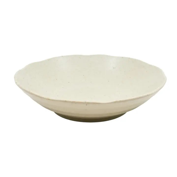 Beige ceramic bowl on a white background