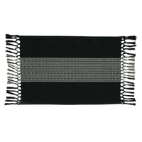 Black woven mat with white fringe on a white background