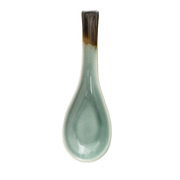 Ceramic spoon with a gradient handle on a white background