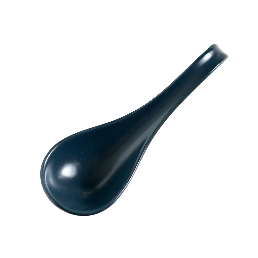Dark blue spoon on white surface