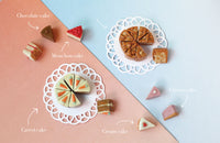 Assorted cake slices on a colorful background with labels indicating the type of cake.