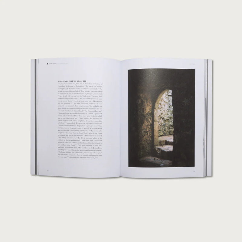 Open book with text on one page and a photograph of a stone archway on the other, on a white background.