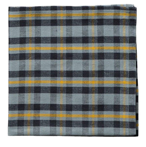 Plaid fabric with blue, black, and yellow pattern on a gray background