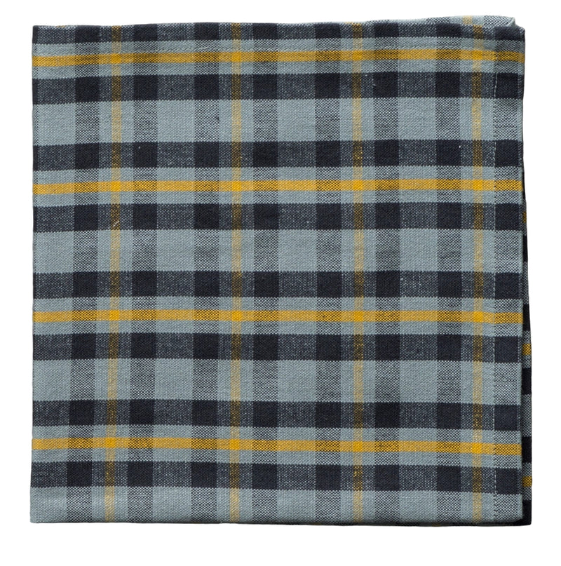 Plaid fabric with blue, black, and yellow pattern on a gray background