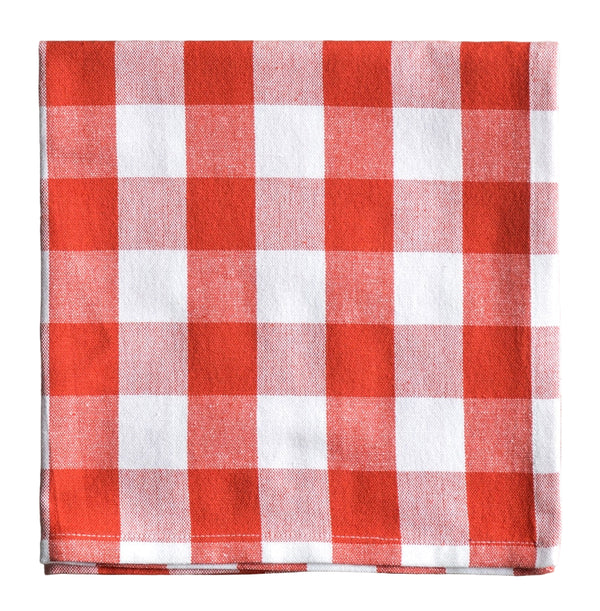 Red and white checkered napkin on a white surface
