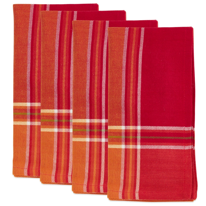 Set of red and orange plaid napkins on a white background