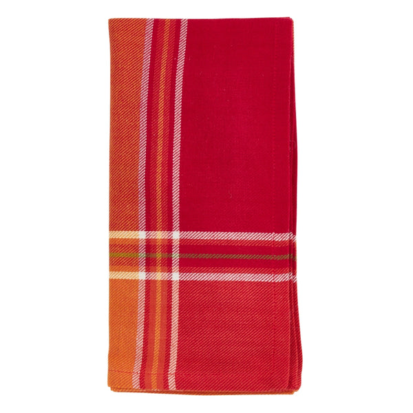 Folded red and orange plaid fabric on a white background