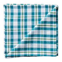 Folded teal and white checkered fabric on a white background