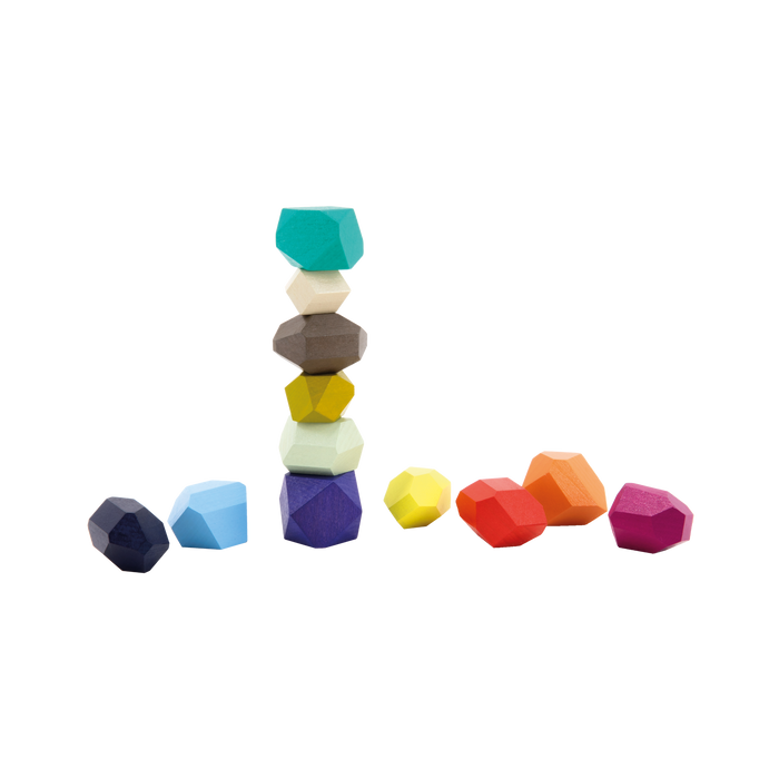 Colorful geometric stacking toys on a white background