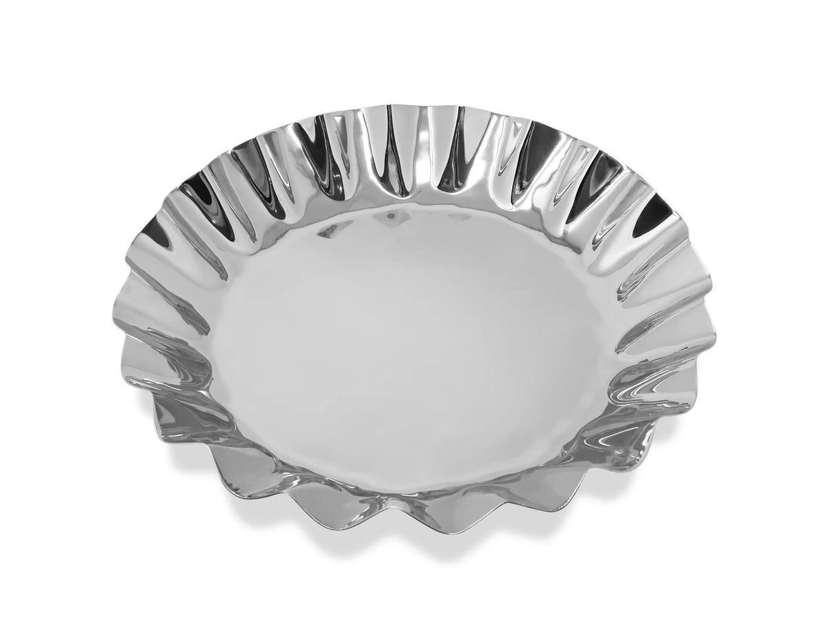 Silver decorative plate with wavy edge on a white background