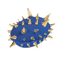 Blue object with gold spikes on a white background