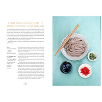 Recipe for cold soba noodles with spring onions and tomato on a blue background