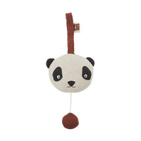 Panda-shaped toy with a brown strap on a white background