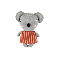 Plush toy koala in a red dress on a white background