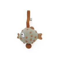Fish-shaped toy with polka dot pattern on a white background
