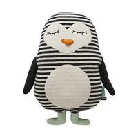cotton toy penguin with black and white striped body on a white background