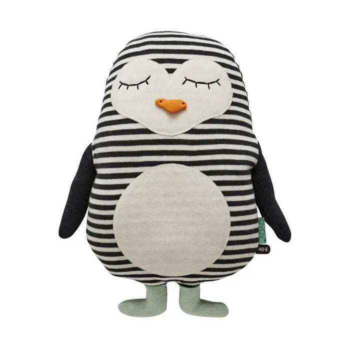 cotton toy penguin with black and white striped body on a white background