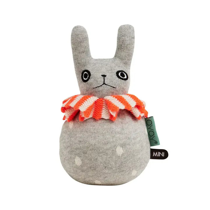 Gray plush toy with a red and white striped bow tie on a white background