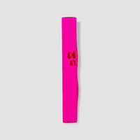 Pink tube with red text on a light gray background