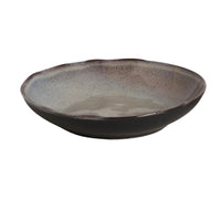 Ceramic bowl with speckled texture on a white background