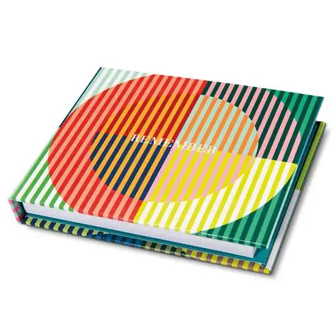 Colorful notebook with geometric design and 'REMEMBER' text on a white background